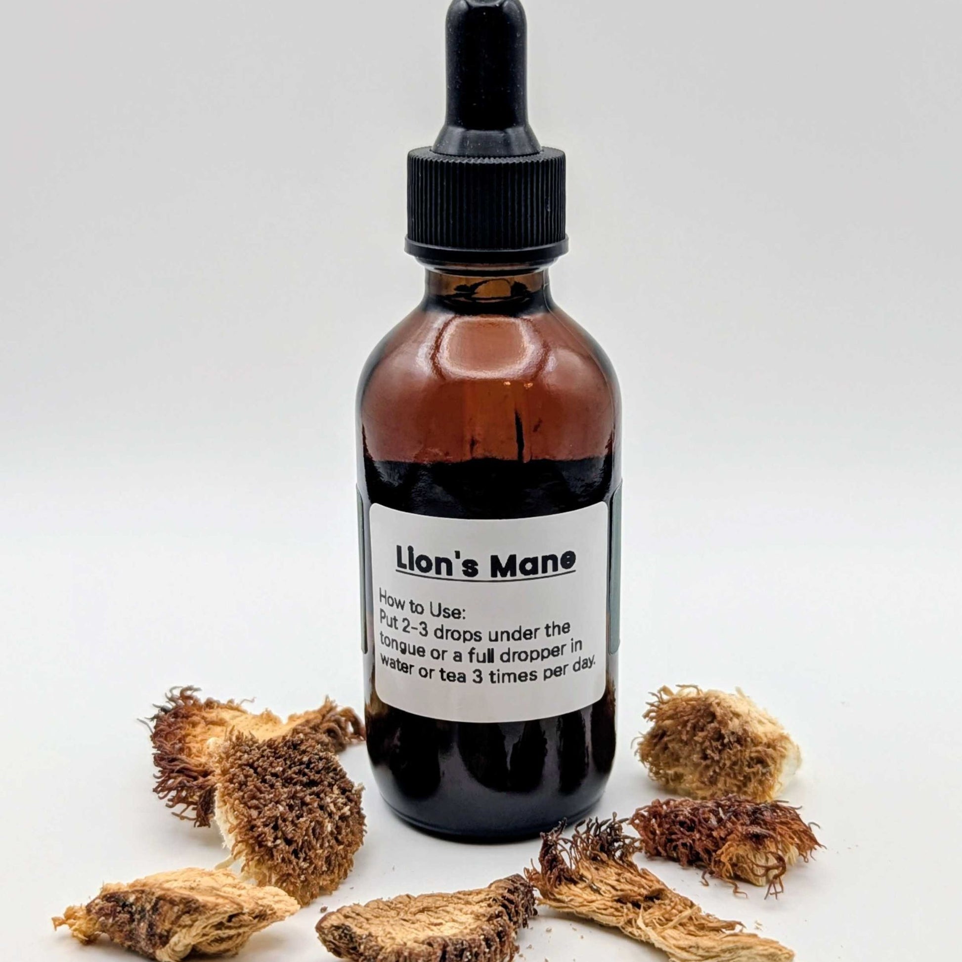 Bottle of 'Lion's Mane' with dried lion's mane mushrooms on a white background