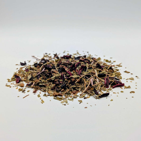 Heap of dried herbs on a white background